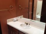 The en-suite bathroom has a single vanity
